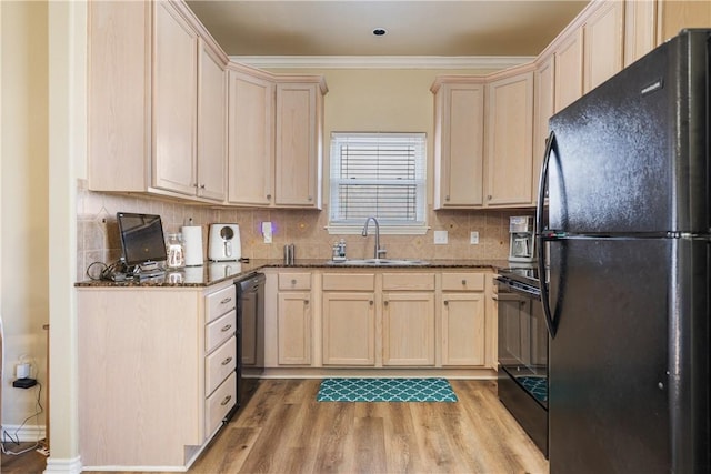 kitchen with backsplash, black appliances, crown molding, sink, and light wood-type flooring