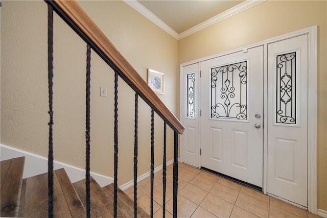 tiled foyer featuring ornamental molding