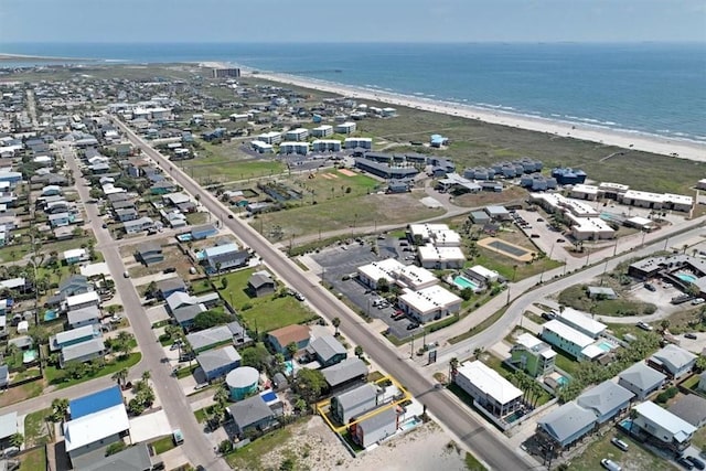 bird's eye view with a water view and a beach view