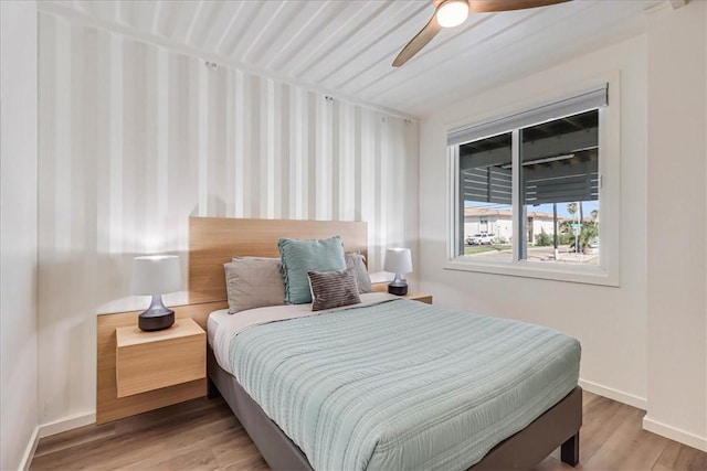 bedroom featuring hardwood / wood-style flooring and ceiling fan