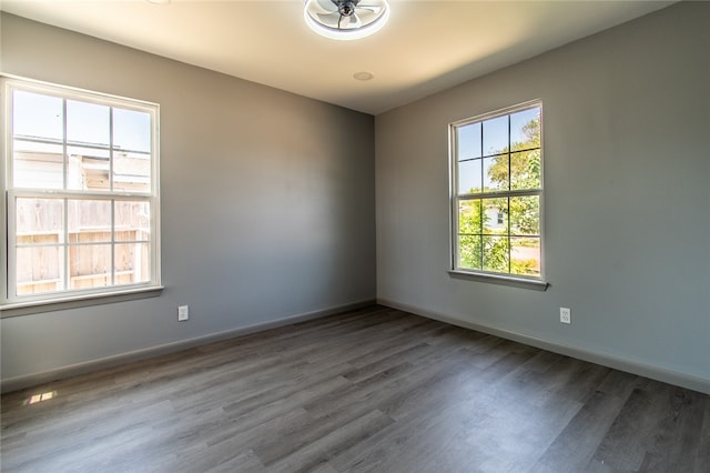 unfurnished room with ceiling fan and wood-type flooring