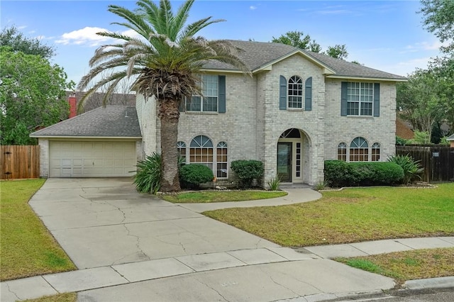 7617 Del Rio Dr, Corpus Christi, TX 78413 - view of front of home with concrete driveway, brick siding, and an attached garage
