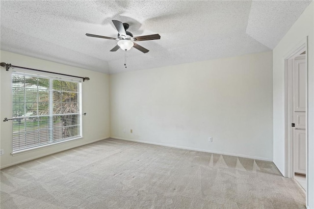 7617 Del Rio Dr, Corpus Christi, TX 78413 - empty room with light colored carpet, a textured ceiling, and ceiling fan