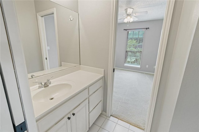 7617 Del Rio Dr, Corpus Christi, TX 78413 - bathroom with vanity, ceiling fan, a textured ceiling, and tile patterned floors