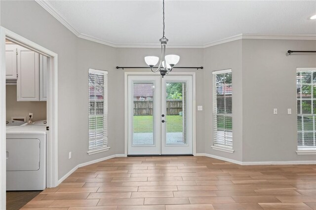 7617 Del Rio Dr, Corpus Christi, TX 78413 - doorway to outside with washer / dryer, a chandelier, light wood-type flooring, french doors, and ornamental molding