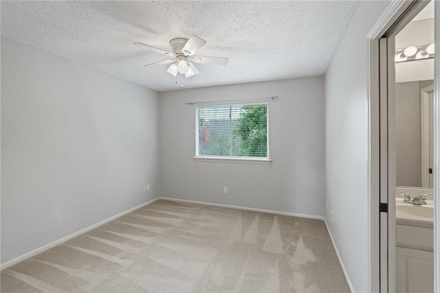 7617 Del Rio Dr, Corpus Christi, TX 78413 - empty room with light carpet, a ceiling fan, and a textured ceiling