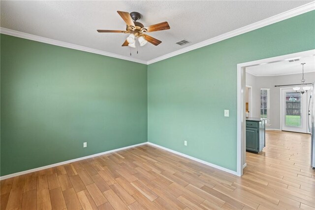7617 Del Rio Dr, Corpus Christi, TX 78413 - empty room featuring light wood-type flooring, a ceiling fan, ornamental molding, a chandelier, and a textured ceiling