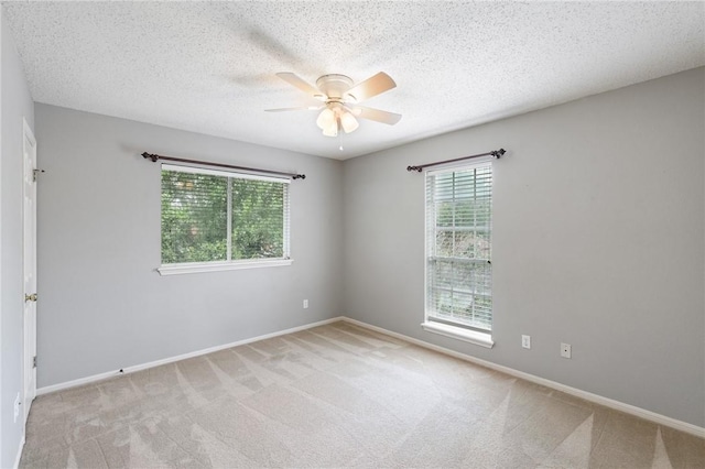 7617 Del Rio Dr, Corpus Christi, TX 78413 - empty room featuring a ceiling fan, carpet, and a textured ceiling