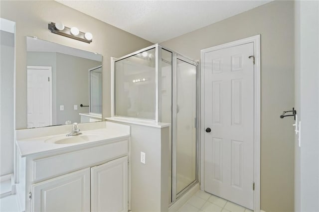 7617 Del Rio Dr, Corpus Christi, TX 78413 - full bathroom with a stall shower, vanity, and tile patterned flooring