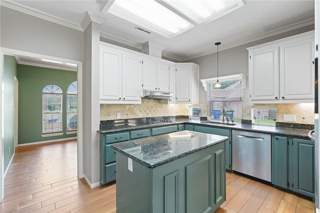7617 Del Rio Dr, Corpus Christi, TX 78413 - kitchen featuring stainless steel dishwasher, under cabinet range hood, white cabinetry, light wood finished floors, and black electric stovetop