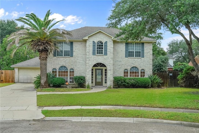 7617 Del Rio Dr, Corpus Christi, TX 78413 - view of front of house with concrete driveway, a garage, and brick siding