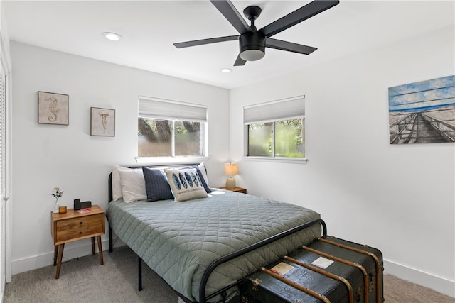 carpeted bedroom with ceiling fan