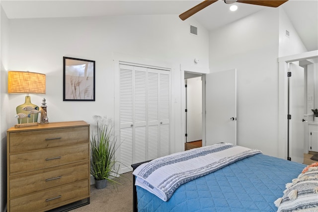 carpeted bedroom with high vaulted ceiling, beamed ceiling, ceiling fan, and a closet