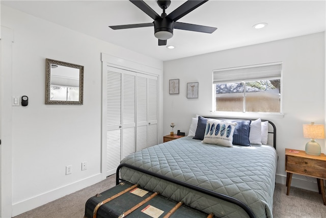 bedroom with carpet, ceiling fan, and a closet