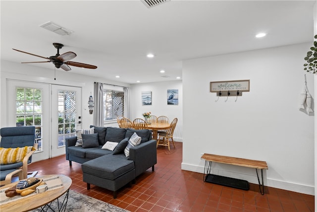 tiled living room featuring ceiling fan