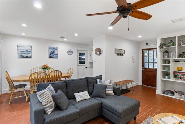 tiled living room featuring ceiling fan