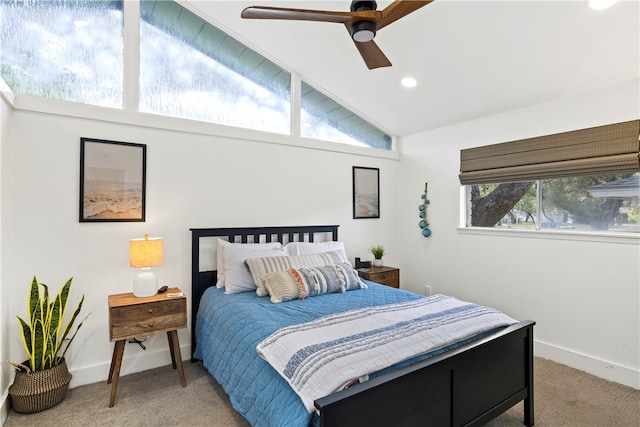 carpeted bedroom featuring ceiling fan and vaulted ceiling