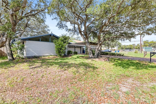 view of yard with a garage