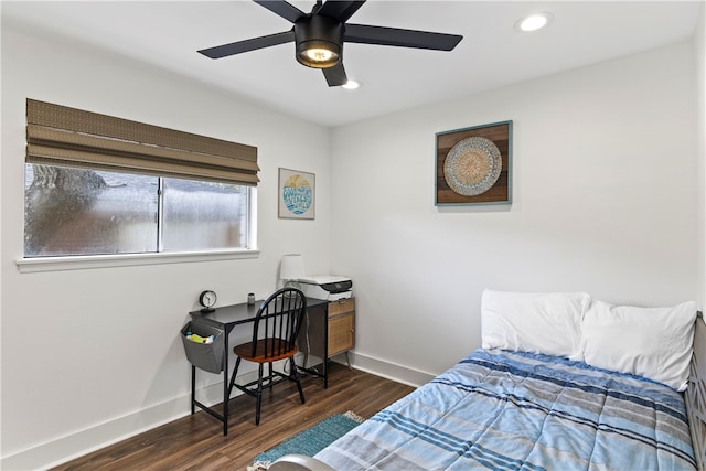 bedroom featuring dark hardwood / wood-style flooring and ceiling fan