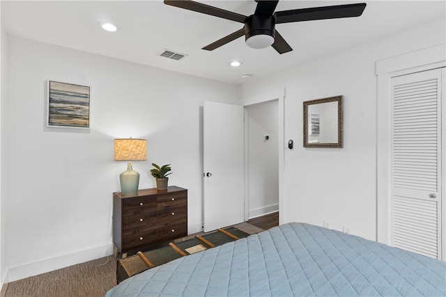 bedroom with ceiling fan and a closet