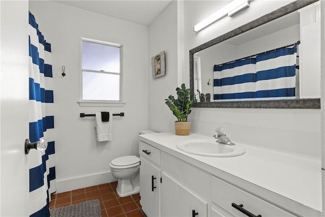 bathroom with vanity, tile patterned flooring, and toilet