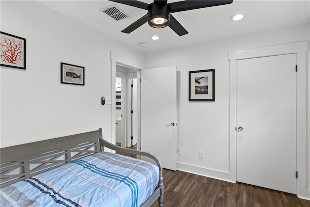 bedroom featuring ceiling fan and dark hardwood / wood-style floors