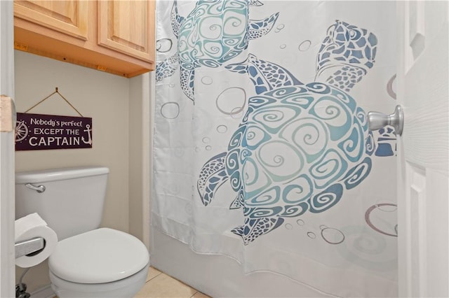 bathroom featuring toilet, shower / bath combo, and tile patterned floors