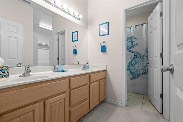 bathroom with tile patterned flooring and vanity