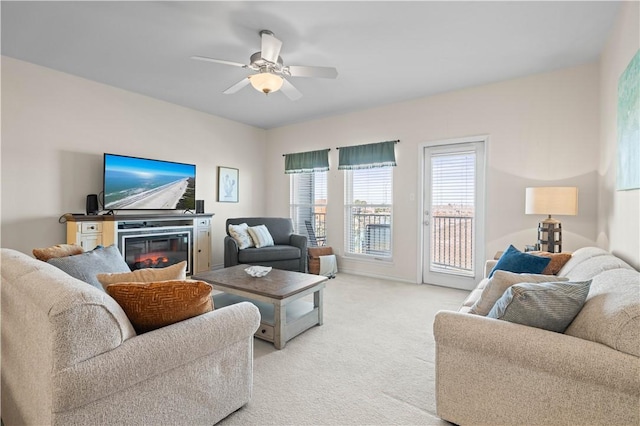 living room featuring light carpet and ceiling fan