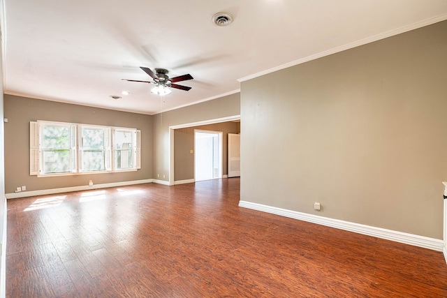 spare room with ceiling fan, dark hardwood / wood-style flooring, and ornamental molding