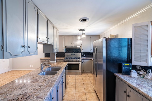 kitchen featuring decorative backsplash, sink, ornamental molding, light tile patterned flooring, and appliances with stainless steel finishes