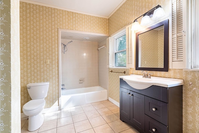 full bathroom featuring tile patterned floors, ornamental molding, vanity, toilet, and tiled shower / bath