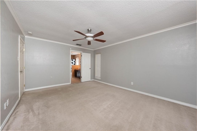 unfurnished bedroom featuring ceiling fan, crown molding, light carpet, and ensuite bath