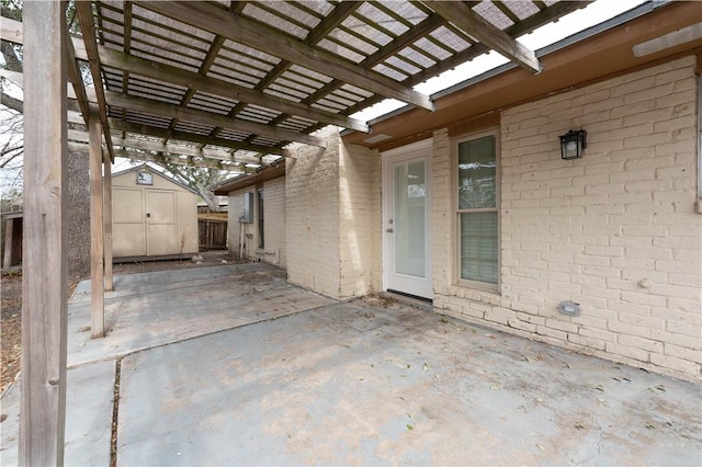 view of patio / terrace with a storage shed and a pergola