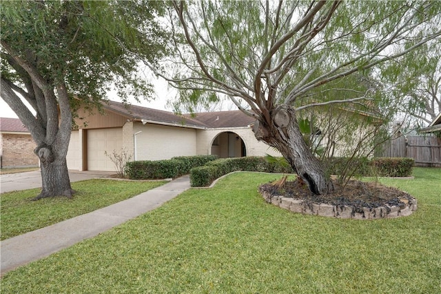 single story home with a garage and a front yard