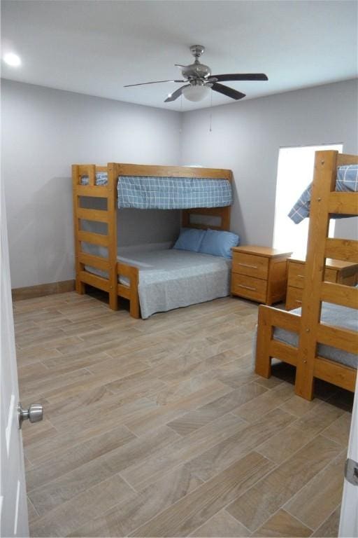 5334 Fm 1069th Rd N, Aransas Pass, TX 78336 - bedroom featuring a ceiling fan, baseboards, wood finished floors, and recessed lighting