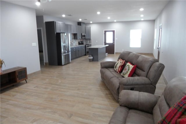 5334 Fm 1069th Rd N, Aransas Pass, TX 78336 - living area featuring recessed lighting, light wood-type flooring, and baseboards