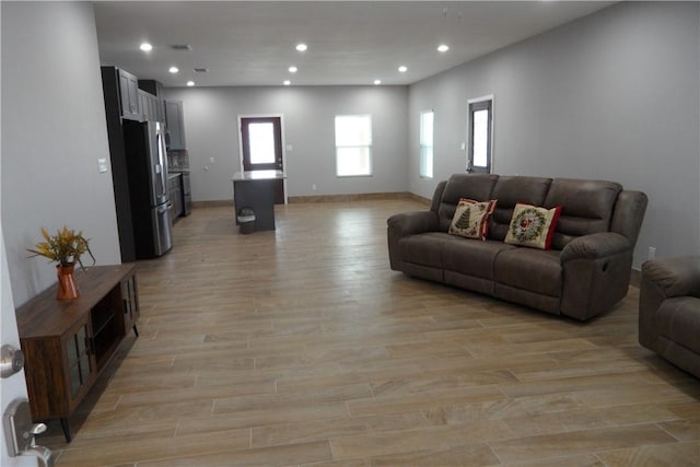 5334 Fm 1069th Rd N, Aransas Pass, TX 78336 - living area featuring recessed lighting, light wood-style floors, and baseboards