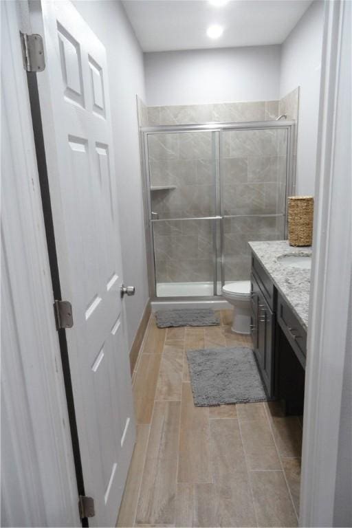 5334 Fm 1069th Rd N, Aransas Pass, TX 78336 - bathroom featuring a stall shower, vanity, and toilet