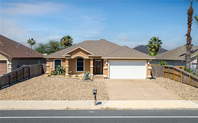 13822 Whitecap Blvd, Corpus Christi, TX 78418 - ranch-style home featuring stucco siding, a garage, driveway, and a shingled roof