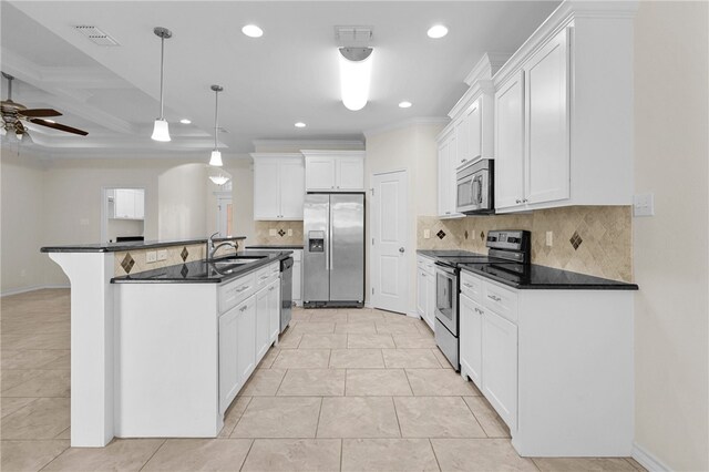 13822 Whitecap Blvd, Corpus Christi, TX 78418 - kitchen with stainless steel appliances, recessed lighting, dark countertops, a ceiling fan, and white cabinetry