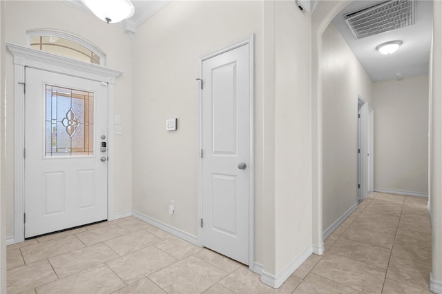 13822 Whitecap Blvd, Corpus Christi, TX 78418 - foyer entrance featuring arched walkways and light tile patterned floors