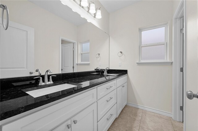 13822 Whitecap Blvd, Corpus Christi, TX 78418 - full bathroom with double vanity, healthy amount of natural light, and tile patterned floors