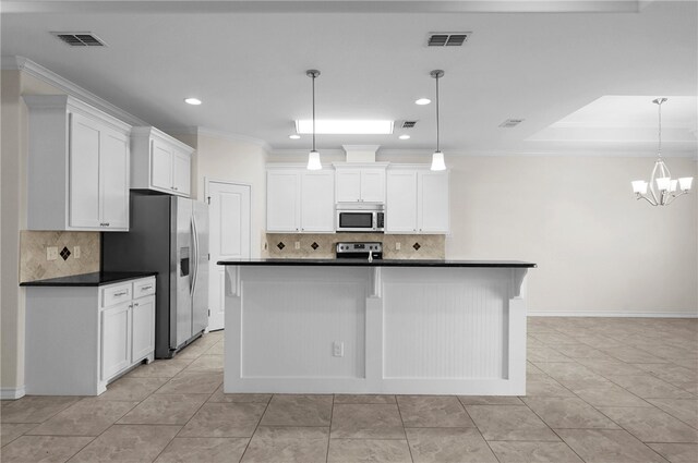 13822 Whitecap Blvd, Corpus Christi, TX 78418 - kitchen with appliances with stainless steel finishes, dark countertops, tasteful backsplash, white cabinets, and recessed lighting