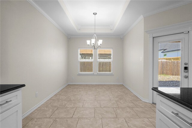 13822 Whitecap Blvd, Corpus Christi, TX 78418 - unfurnished dining area featuring a chandelier, plenty of natural light, a raised ceiling, crown molding, and light tile patterned flooring