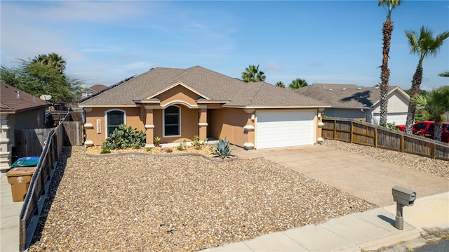 13822 Whitecap Blvd, Corpus Christi, TX 78418 - ranch-style house with stucco siding, concrete driveway, and a garage