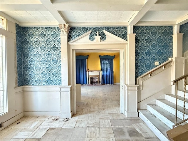 interior space with beamed ceiling and parquet floors