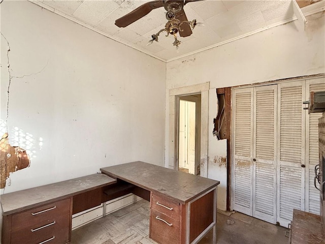 unfurnished office with ceiling fan