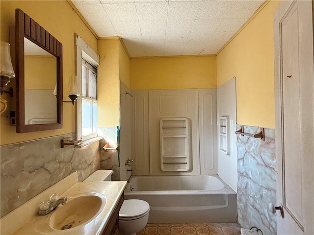 full bathroom with vanity, tub / shower combination, and toilet