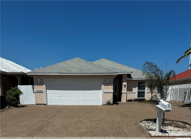 ranch-style home with a garage